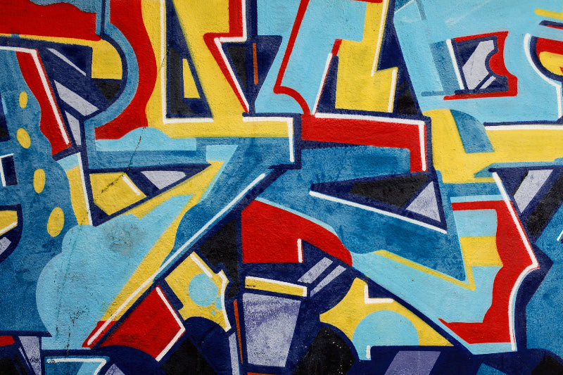 Foto von einem graffiti in Nahaufnahme in rot, blau und geb. 